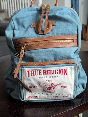 True Religion Light Blue Denim Backpack with Brown Trim and Gold Hardware